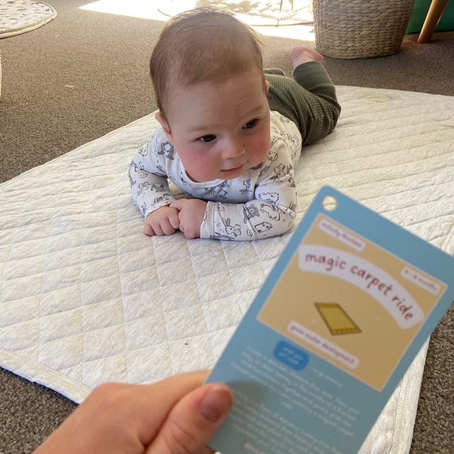 A Learn With Me card being used during tummy time